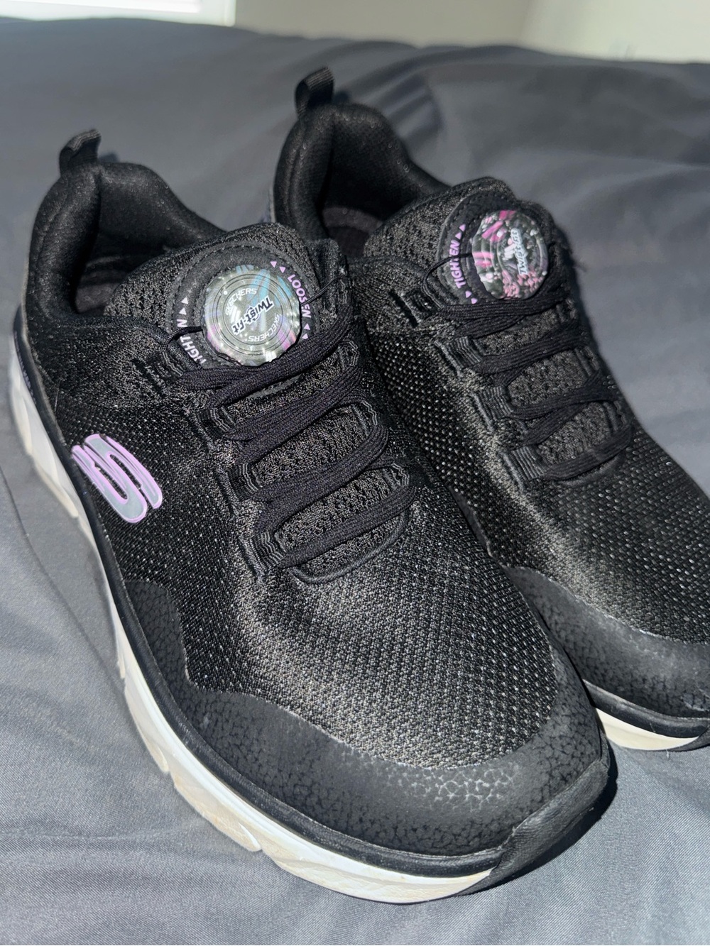 Skechers Kids Black Slip-On Sneakers with Lilac Logo and Dial